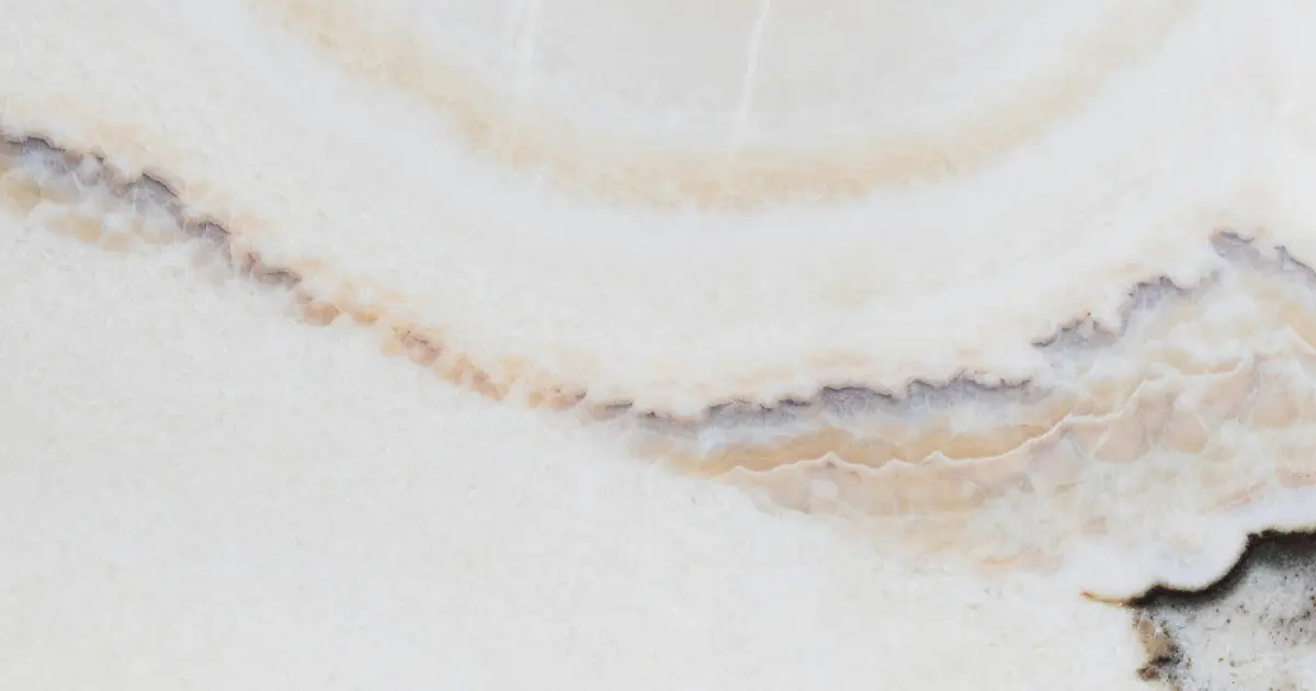 A white and beige stone countertop up close